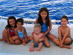 Happy children on a family catamaran tour