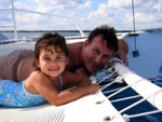 Relax on the catamaran trampoline snorkeling tour